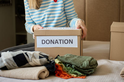 Midsection of woman using laptop