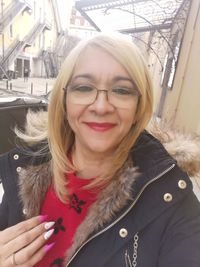 Portrait of smiling woman in snow