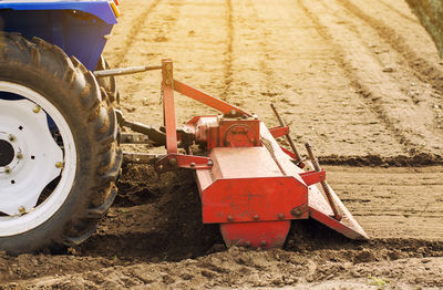 Tractor with milling machine loosens, grinds and mixes soil. loosening the surface, cultivating 