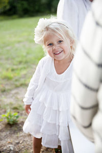 Smiling girl looking at camera, sweden