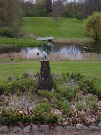 Gazebo on field by lake