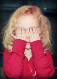 Close-up of girl with hand in hair