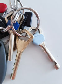 High angle view of keys over white background