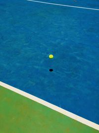 High angle view of yellow ball in swimming pool