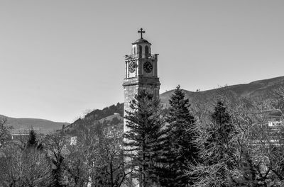 Low angle view of bell tower against clear sky