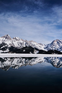 Scenic view of snowcapped mountains against sky