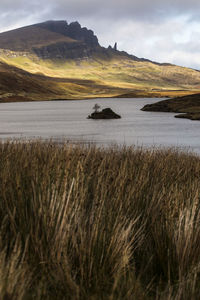 Scenic view of lake and mountains against sky