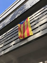 Low angle view of flags on windows
