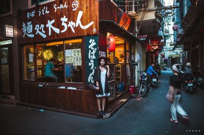 People on city street at night