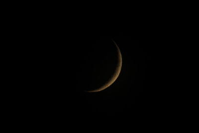 Low angle view of moon against sky at night