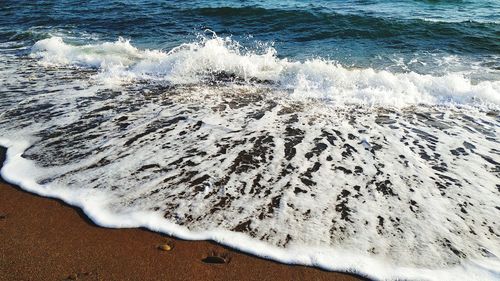 High angle view of surf on beach