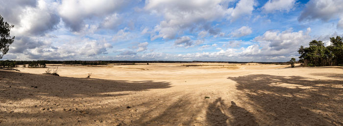 Panoramic view of desert against sky