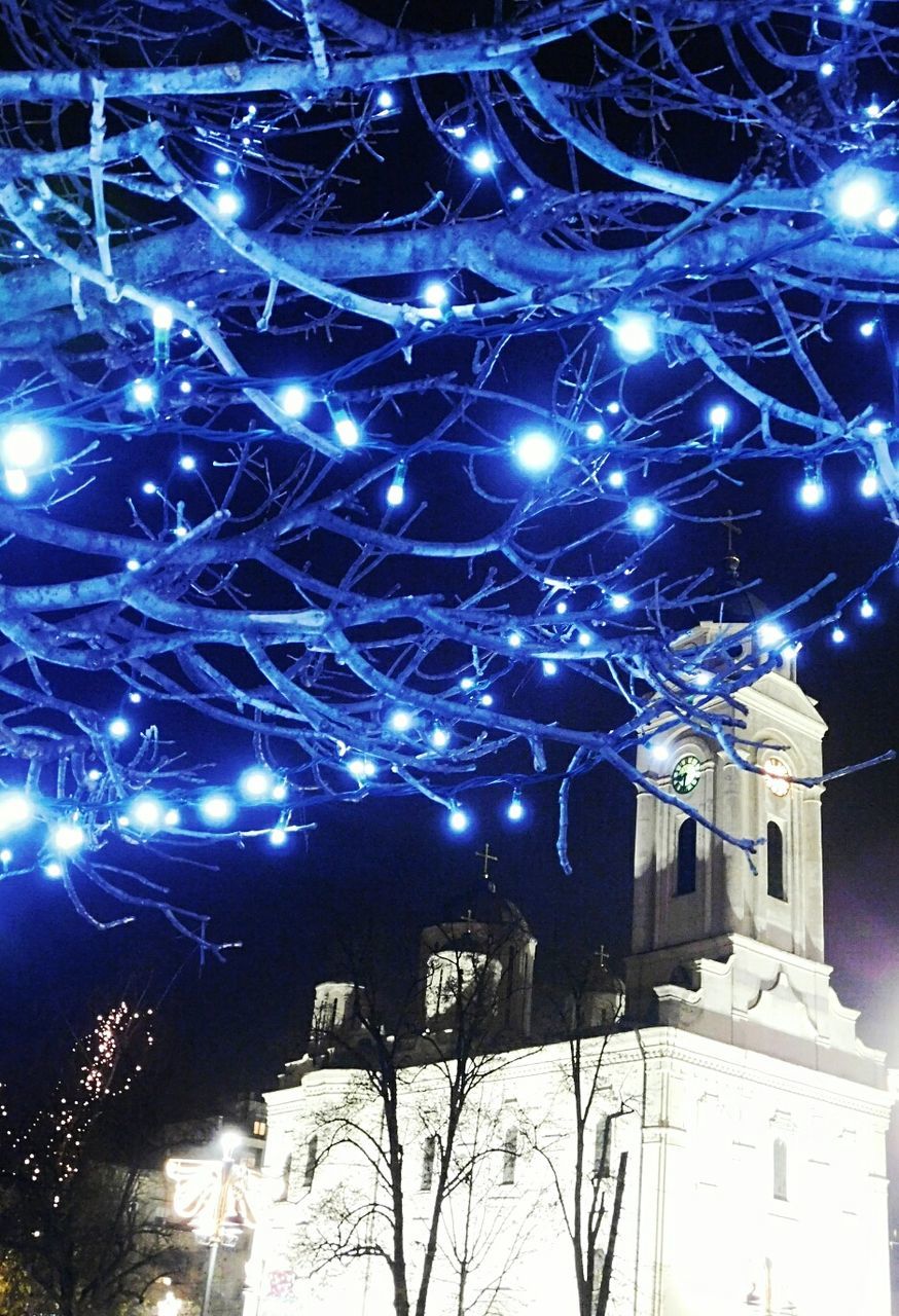 LOW ANGLE VIEW OF ILLUMINATED BUILT STRUCTURE