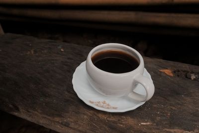 High angle view of coffee cup on table