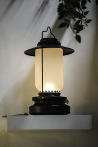 Close-up of lamp on table