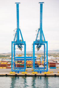 Containers against clear sky at the port