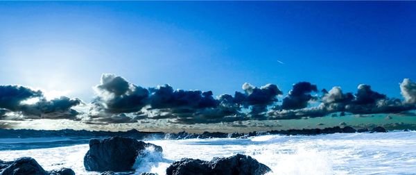 Panoramic seascape against dramatic sky