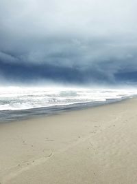 Scenic view of beach against sky