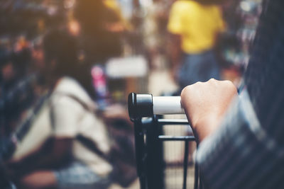 Midsection of person holding umbrella