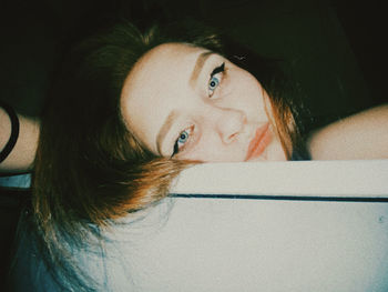 Portrait of woman looking away at home