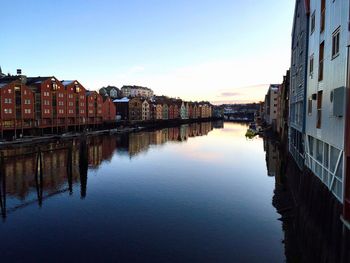 River amidst buildings against sky in city