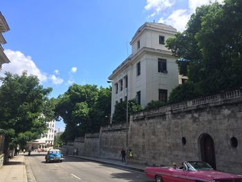 City street against cloudy sky