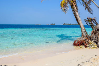 Scenic view of sea against blue sky