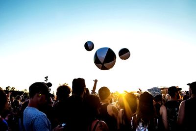 Group of people against the sky