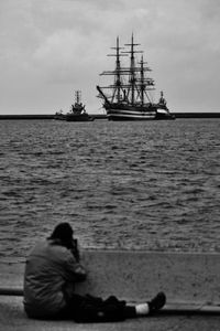 People sitting on boat in sea