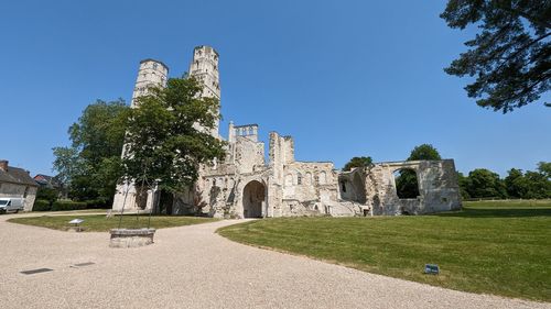 Low angle view of old ruins against sky