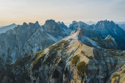 Scenic view of snowcapped mountains against sky during sunset