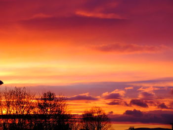 Low angle view of cloudy sky at sunset