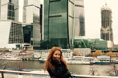 High angle view of woman looking at city skyline