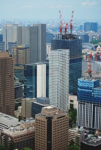 Modern buildings in city against sky