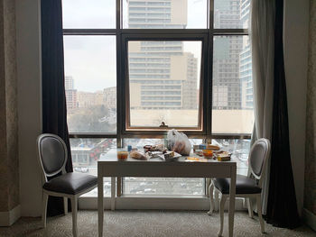 Chairs and tables in glass window at home