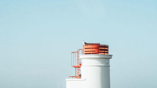 Low angle view of lighthouse against clear sky