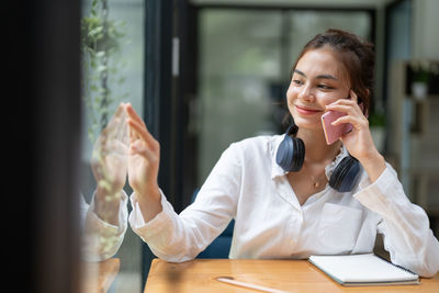 Young woman using mobile phone