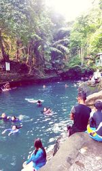 People relaxing in lake