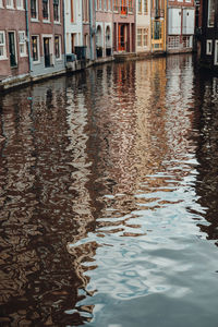 High angle view of canal amidst buildings in city