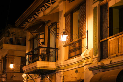 Low angle view of illuminated building at night