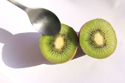 Close-up of fruits over white background