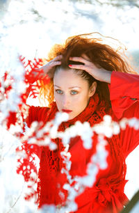 Girl with red hair in red clothes