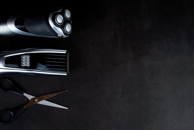 Directly above shot of electric lamp on table against black background