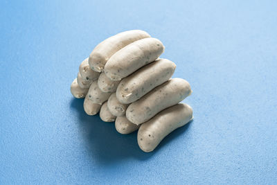 Close-up of pebbles on table against blue background