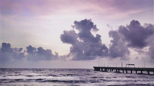 Scenic view of sea against storm clouds