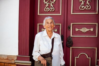 Senior woman tourist at the beautiful heritage town of jerico located in colombia.