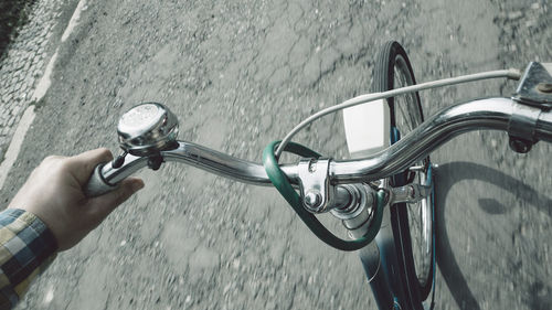 High angle view of man riding bicycle on road 