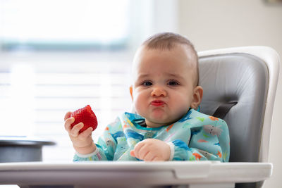 Portrait of cute girl holding toy