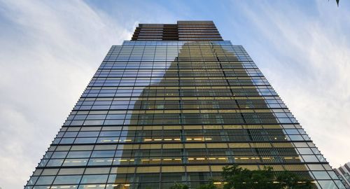 Low angle view of skyscraper against sky