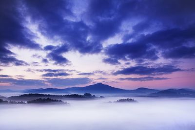 Scenic view of mountains against sky during sunset